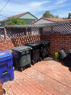 Large black trash cans. No cracks