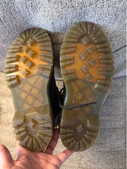 Dr. Martens boots, identified by product code (contact info removed)1, in a US size 5