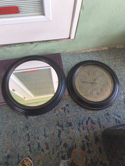 wall mirror and a matching vintage-style analog wall clock