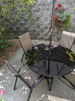Outdoor Glass round  table 50" with 6 chairs and solar powered umbrella