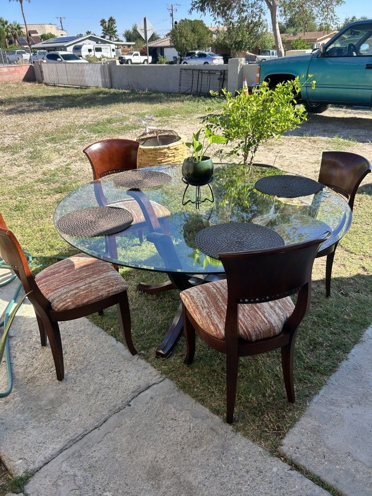 Glass Top Is 5ft Round and Includes 6 Chairs For Sale 