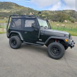 Jeep Wrangler TJ With Roof Rack Tires