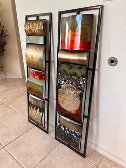 Set of two large piece decorative metal wall art panels.