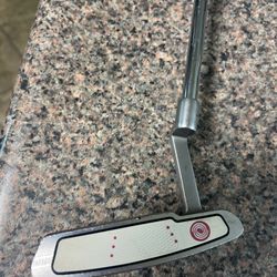 putter, Odyssey, white hat, 36 inch, balotta face for better roll, fat boy, grip wrapped in red, time for you to pick up three or four strokes / a rou