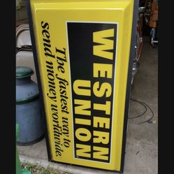 Western Union Sign Lights Up