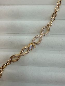 Gold-Tone Infinity Bracelet with Stones