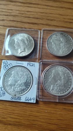 3 Morgans and one peace dollar
