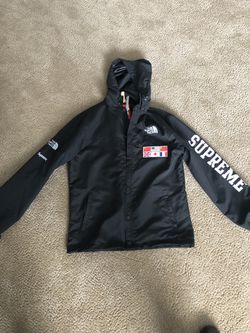 Windbreaker jacket. Has north face supreme patches.