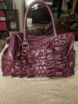 Fossil patent leather shiny bag ruffles in front