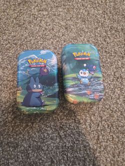 2 pokemon tins with 31 cards each
