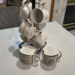 a set of holiday cups on a metal stand