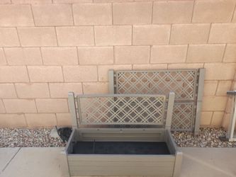 Raised garden bed with trellis.