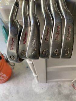 Wilson clubs, a pitching wedge, and a putter