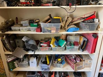 Assorted tools including screwdrivers, fasteners, saw blade
