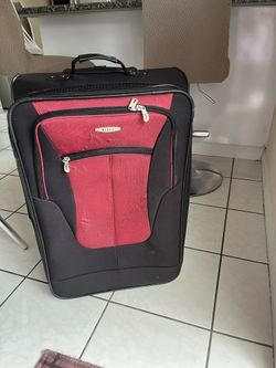 Large suitcase in good, clean condition—free of pet dander and cigarette smoke. It features two wheels that roll very smoothly. Its dimensions are: 27