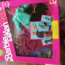 Two Sets Of Barbie And Ken Clothes