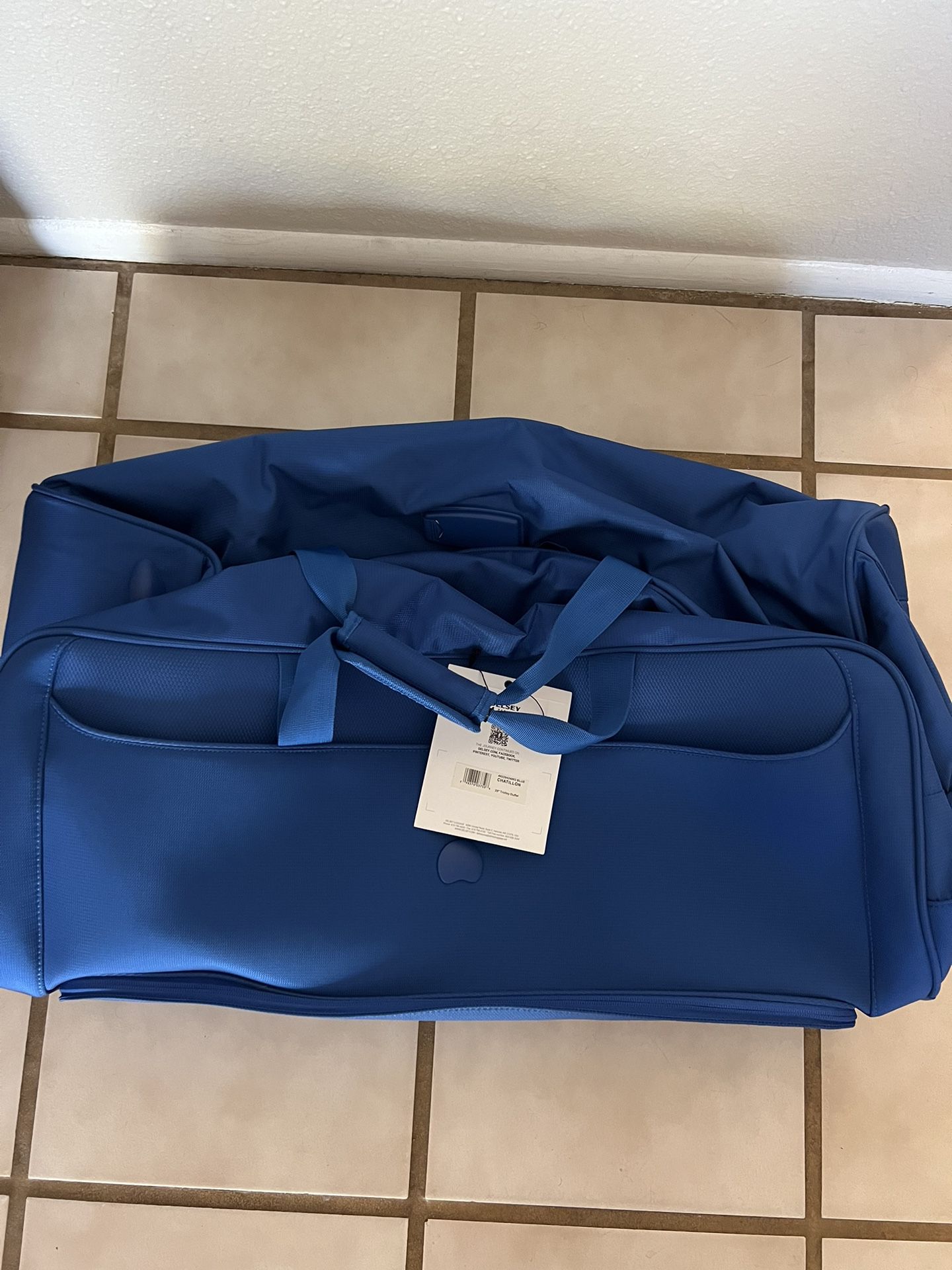 Brand New Delsey Luggage/Suitcase Blue Rolling Duffle 28”