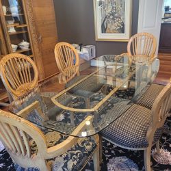 Beautiful dining room set with glass table and six chairs.  Gotta Go This Weekend. All Offers Considered