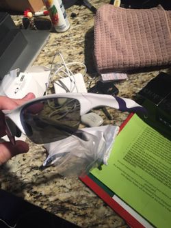 2 pairs of Oakley sunglasses