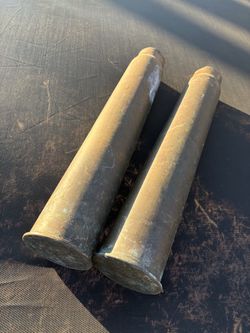 Two 3” M77 1944 brass shell casings.