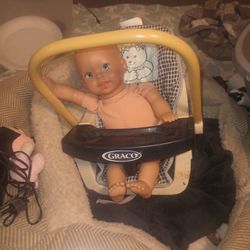 Old Doll In Carrier