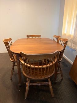 Wooden dining table with extension leaf & chairs