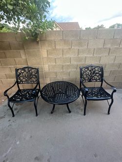 Patio set. Chairs and coffee table. Very nice. All metal.