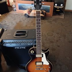 CRATE sunburst color electric guitar with 65 watt CRATE amp and hard case and CRATE foot switch controls plays great 