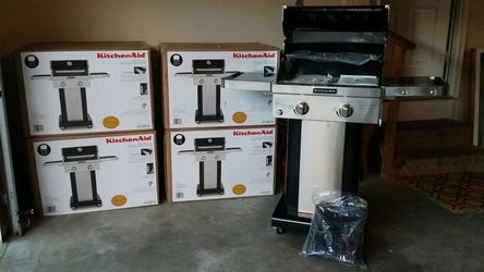 2 burner propane/gas. NEW IN BOX W/GRILL COVER