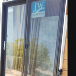 60x80 exterior sliding door new construction, Left hand, dark Brown outside white inside,