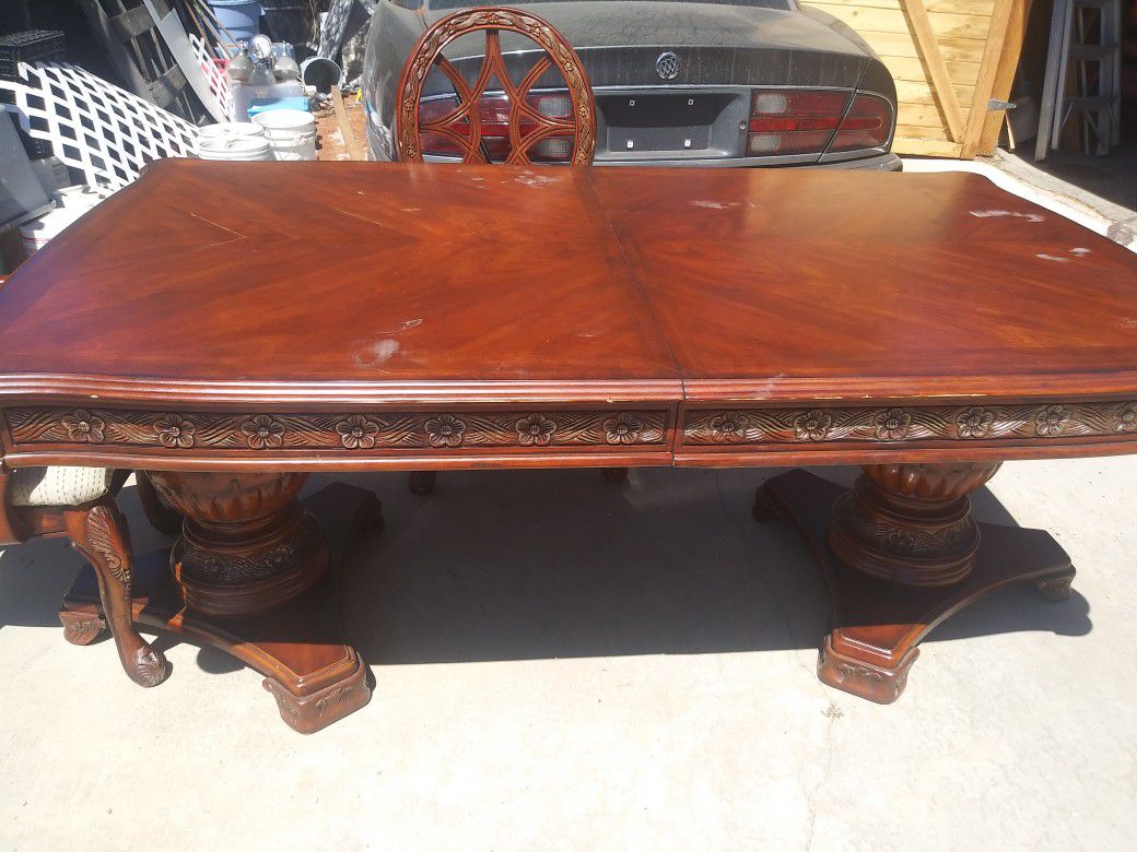 It is a decorative kitchen table with four chairs