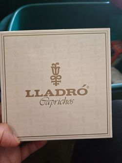 Lladro caprichos pink hat.