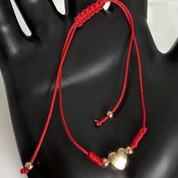 string bracelet with gold plated accessories