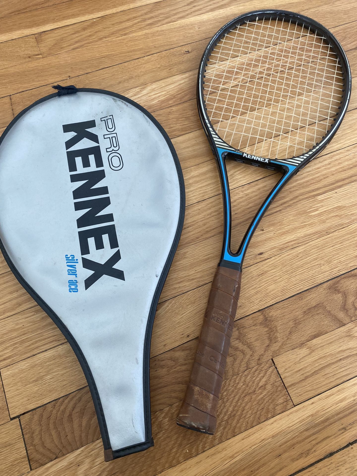 pro kennel mid size graphite silver ace tennis racket and jacket /11” width 27” length 