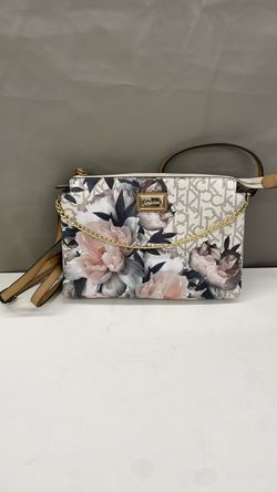 Calvin Klein flower purse. Item No 877 (Shopgoodwill)