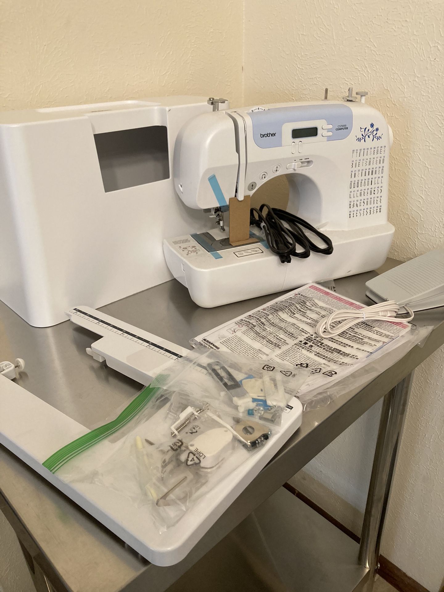 Never Been Used! Brother Sewing and Quilting Machine, CS7000i, 70 Built-in Stitches, 2.0" LCD Display, Wide Table, 10 Included Sewing Feet