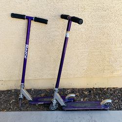 Two Purple Razor Scooters