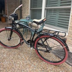Huffy 26" Nel Lusso Men's Cruiser Bike in matte black with custom red tires and pink grips. 
