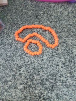 Homemade orange necklace and bracelet.