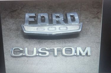Vintage 'Ford 600' and 'Ford "Custom' Emblems