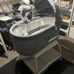 TruBliss Baby Sweetli Deluxe Infant Bassinet Bedside Crib Sleeper with Play2Sleep Electric Mobile, Room Temperature and Humidity Indicator, Feeding Re