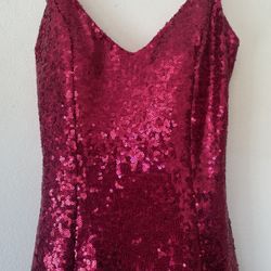 A very beautiful dress in a bright pink color with sparkle.