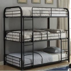 Triple tier bunk bed with mattresses
