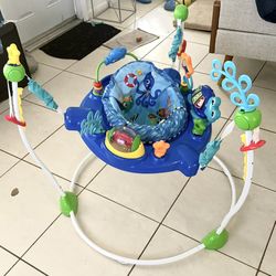 Saltador Baby Einstein Neptune's Ocean Centro de Actividades de Descubrimiento Jumper, Edades 6 Meses +