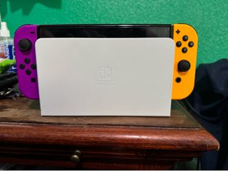 Nintendo Switch OLED with Purple/Orange Joy-cons, Pro Controller, Hori Split Pad and Super Mario 3D World
