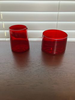 Petite and unique red glass creamer and sugar