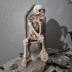 Skeleton On Toilet