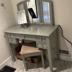 Vanity Table With A Mirror And a Stool 