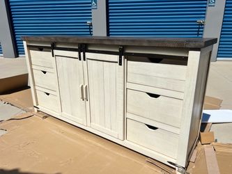 Brand New. 70 Inch Barn Door Server In Vintage White color. $549