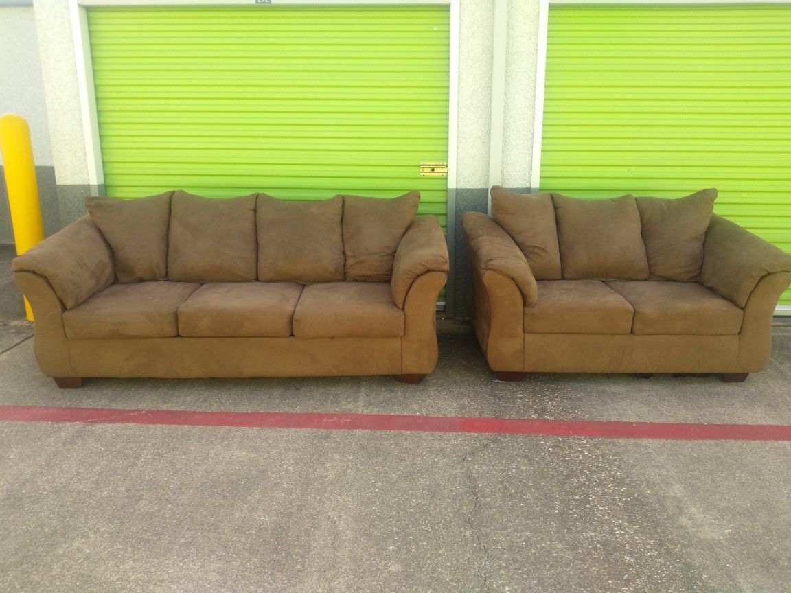 Brown couch and loveseat